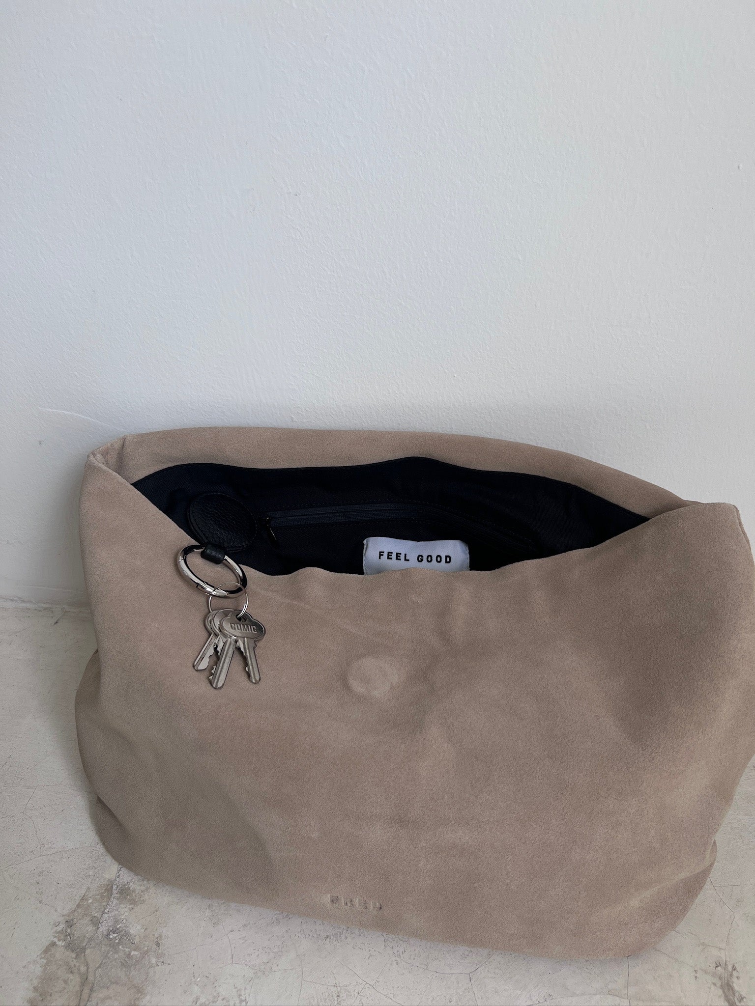 SUEDE CLUTCH in SAND